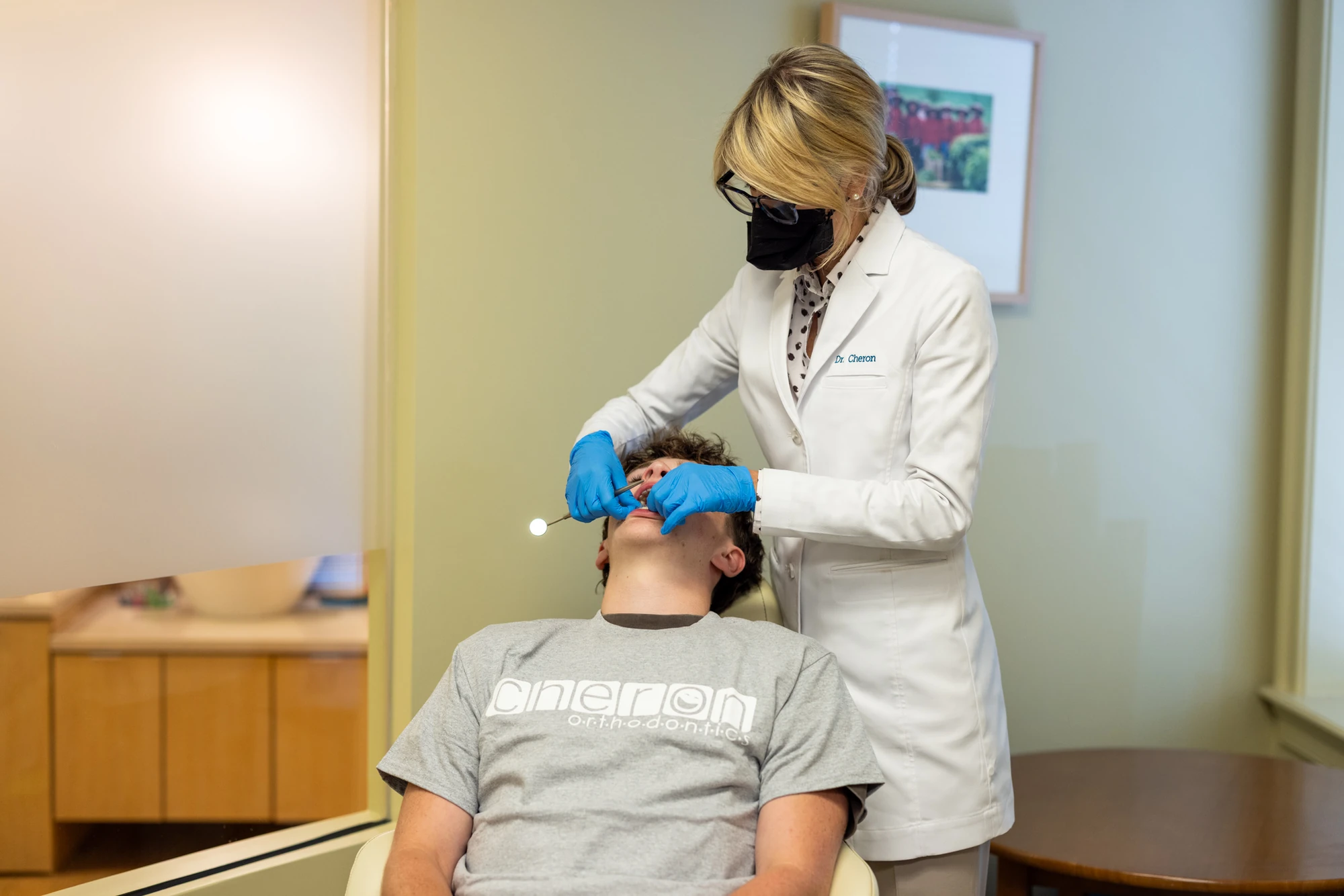 A young patient checking in for their first visit at Cheron Orthodontics